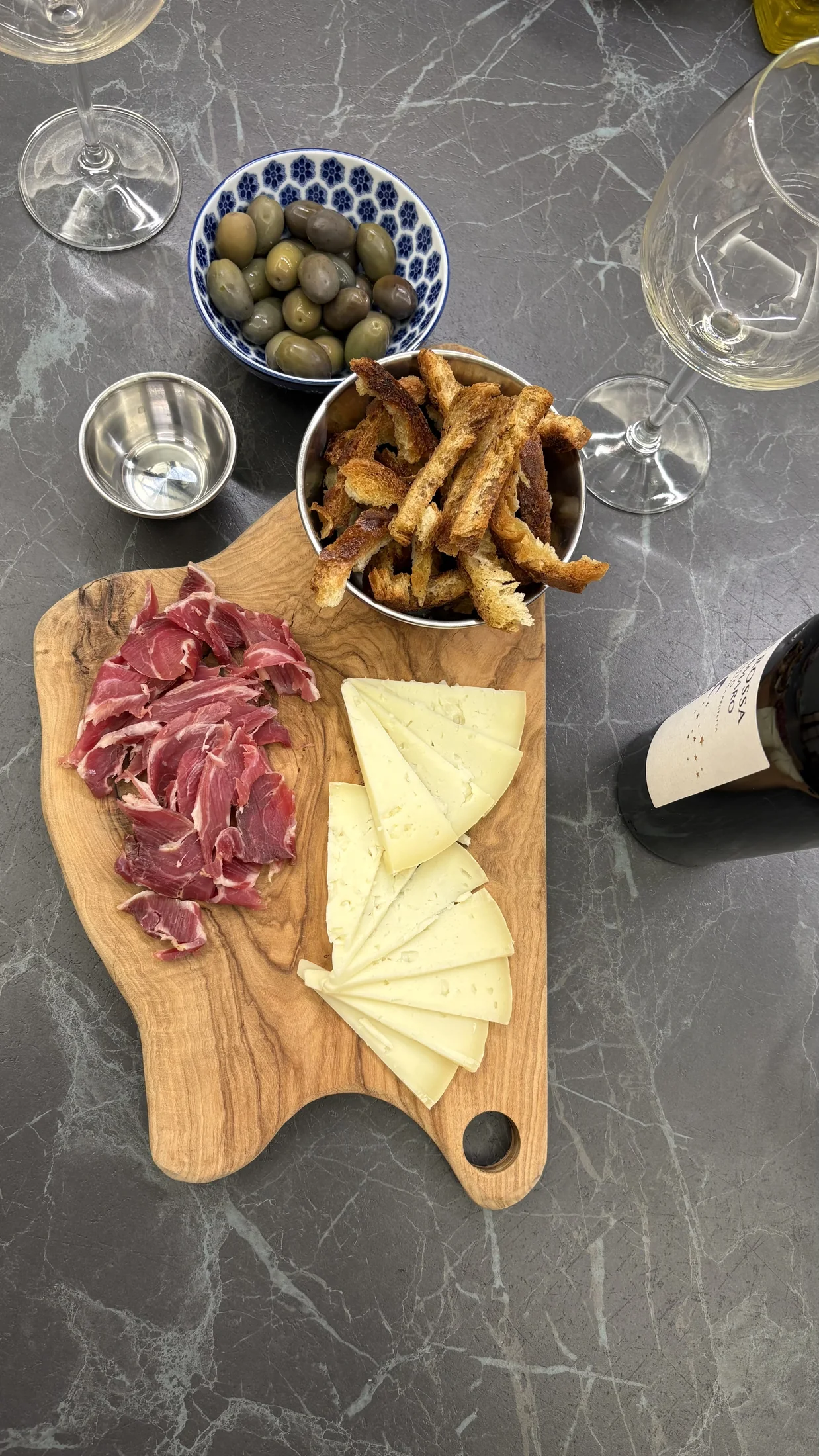 Aperitivo board with cured meats, cheese and olives